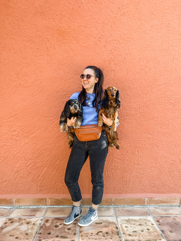 Woman wearing Kibou dog training fanny pack
